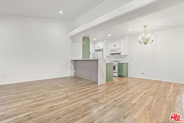a view of a kitchen with a sink and dishwasher