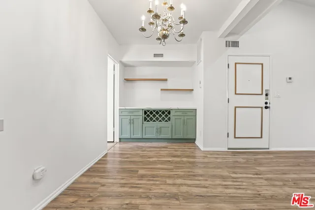 a kitchen with a stove a sink and a refrigerator
