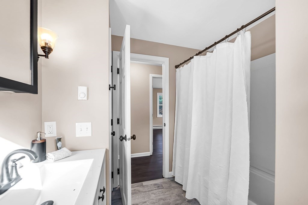 9 Hillside Road Leicester, MA 01611 - Photo 17 of 42 a bathroom with a sink and a mirror