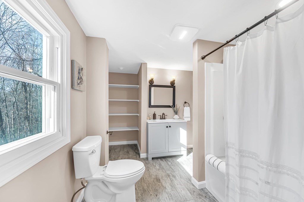 9 Hillside Road Leicester, MA 01611 - Photo 24 of 42 a bathroom with a toilet a sink and a shower