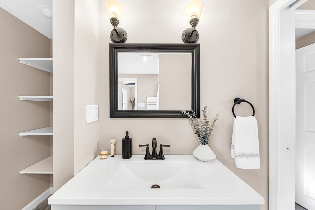 9 Hillside Road Leicester, MA 01611 - Photo 26 of 42 a bathroom with a sink and a mirror