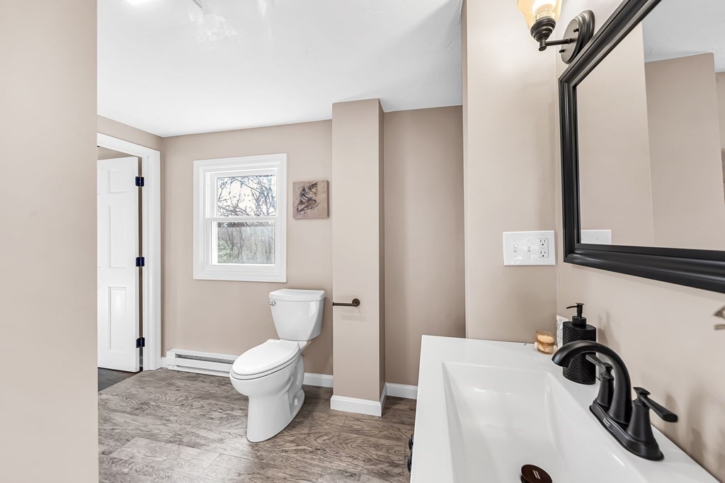 9 Hillside Road Leicester, MA 01611 - Photo 28 of 42 a bathroom with a sink toilet and a mirror