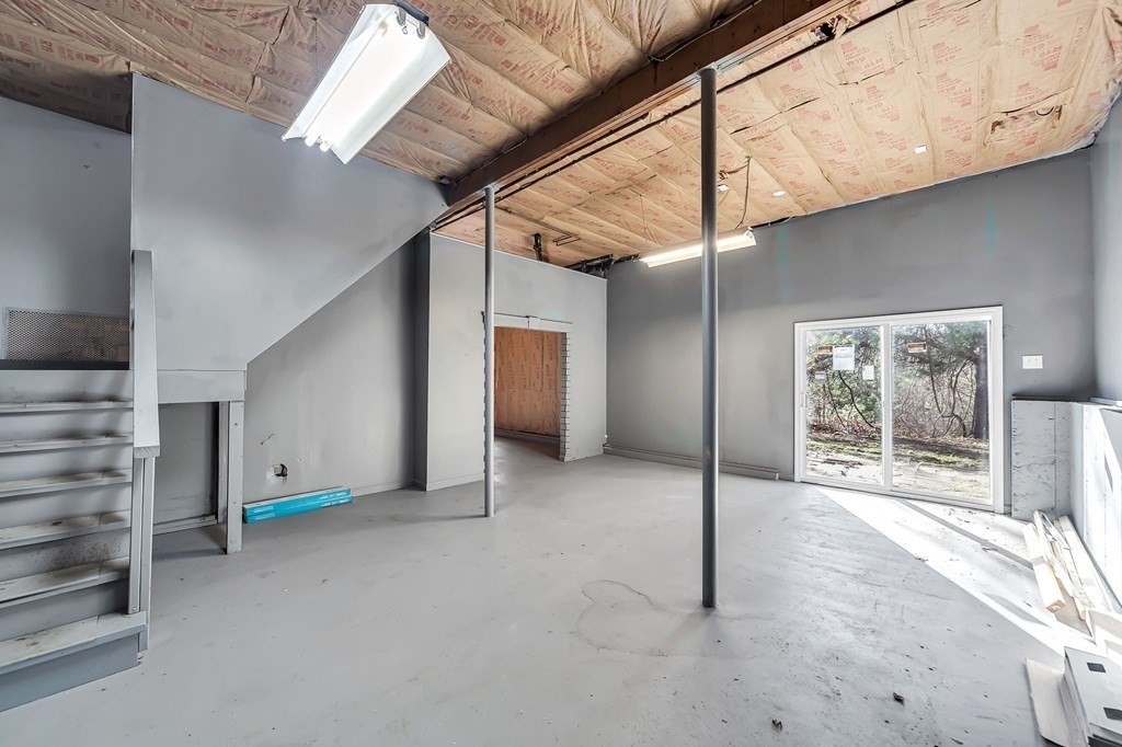 9 Hillside Road Leicester, MA 01611 - Photo 33 of 42 a view of an empty room with a fireplace