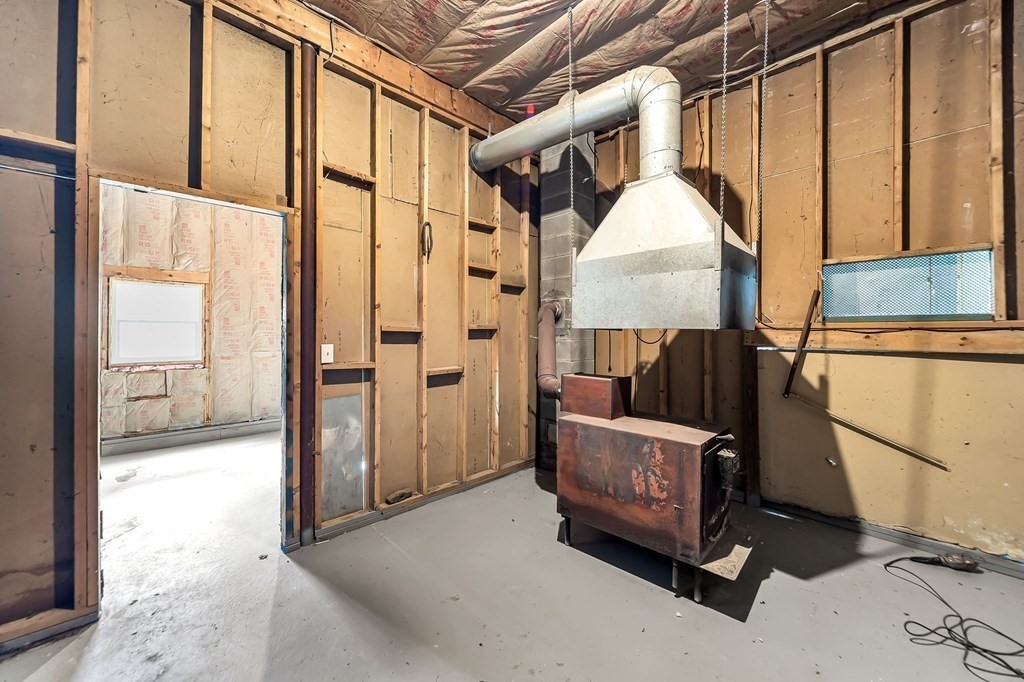 9 Hillside Road Leicester, MA 01611 - Photo 35 of 42 a view of a hallway with wooden walls and entryway