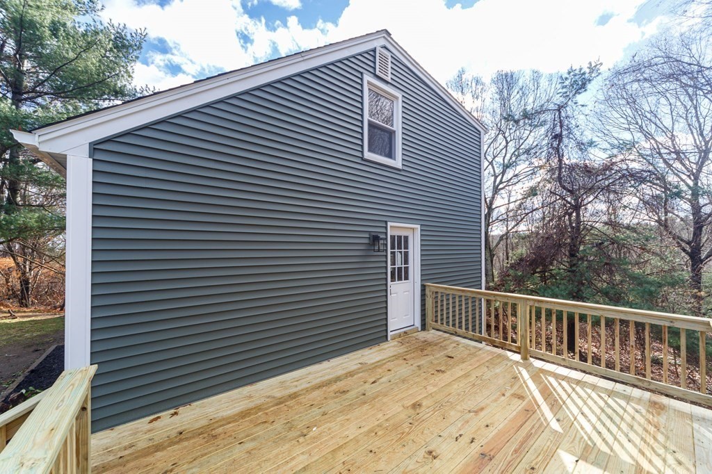 9 Hillside Road Leicester, MA 01611 - Photo 40 of 42 a view of a roof deck with wooden fence