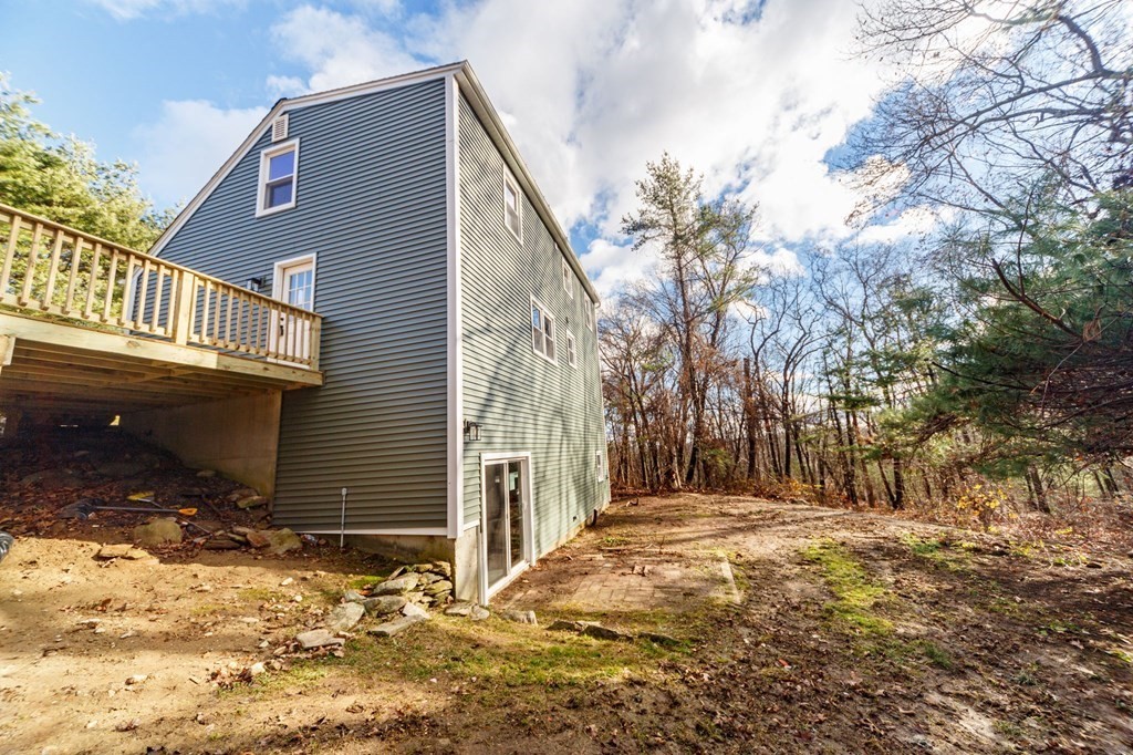 9 Hillside Road Leicester, MA 01611 - Photo 41 of 42 a view of a house with a yard covered in snow