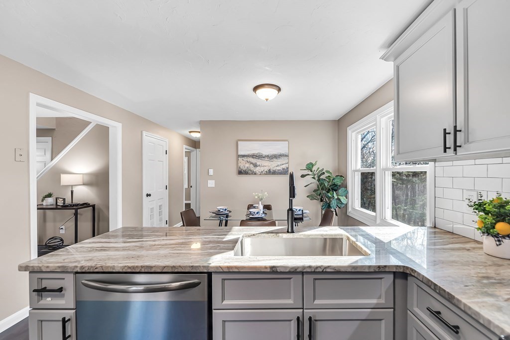 9 Hillside Road Leicester, MA 01611 - Photo 8 of 42 a kitchen with stainless steel appliances granite countertop a sink and a refrigerator