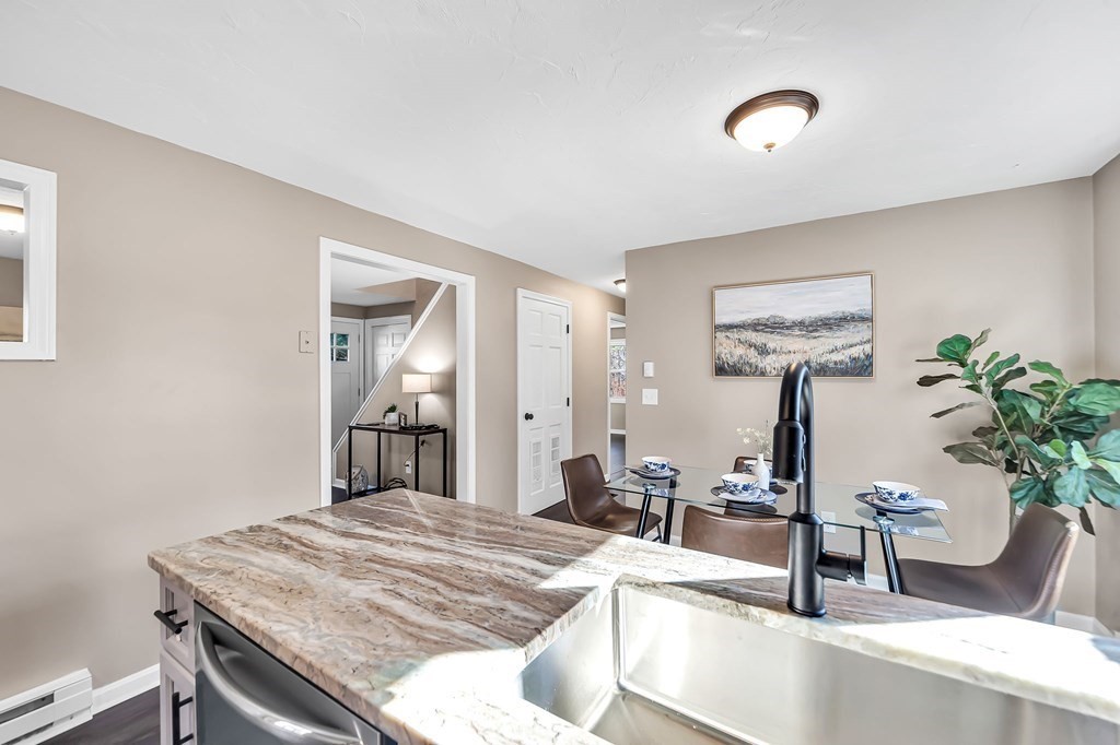 9 Hillside Road Leicester, MA 01611 - Photo 9 of 42 a living room with furniture and potted plant