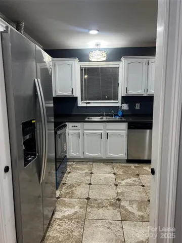 a view of wooden fence and trees