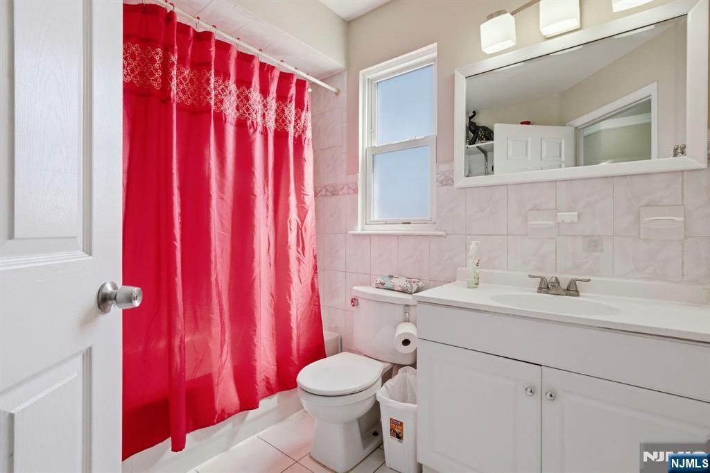 56 Lentz Avenue Newark, NJ 07105 - Photo 14 of 50 a bathroom with a sink toilet and shower
