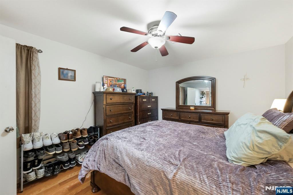 56 Lentz Avenue Newark, NJ 07105 - Photo 15 of 50 a bedroom with a bed and dresser