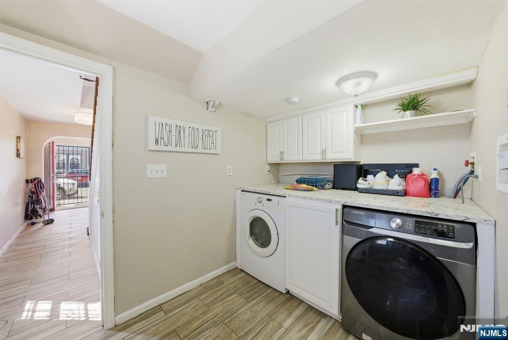 56 Lentz Avenue Newark, NJ 07105 - Photo 17 of 50 a utility room with sink dryer and washer