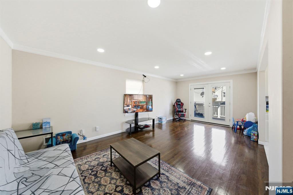 56 Lentz Avenue Newark, NJ 07105 - Photo 18 of 50 a living room with furniture and a wooden floor