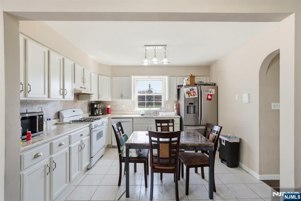 56 Lentz Avenue Newark, NJ 07105 - Photo 20 of 50 a view of a dining room with furniture and window