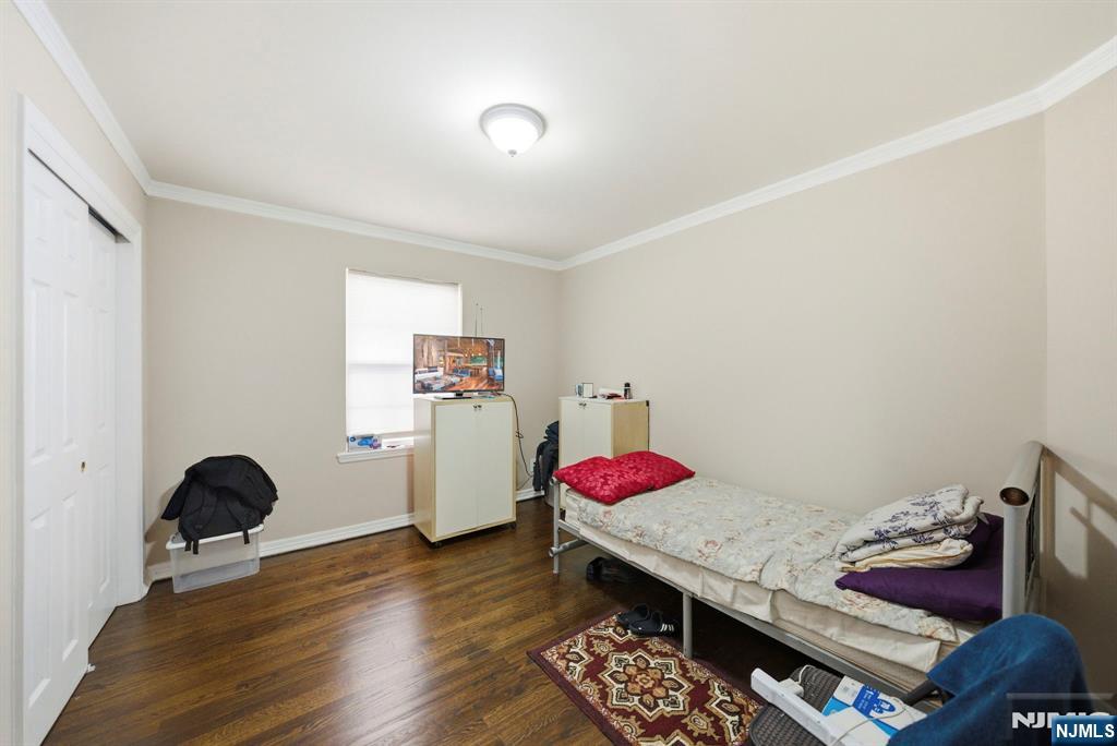 56 Lentz Avenue Newark, NJ 07105 - Photo 22 of 50 a view of a workspace with furniture and wooden floor