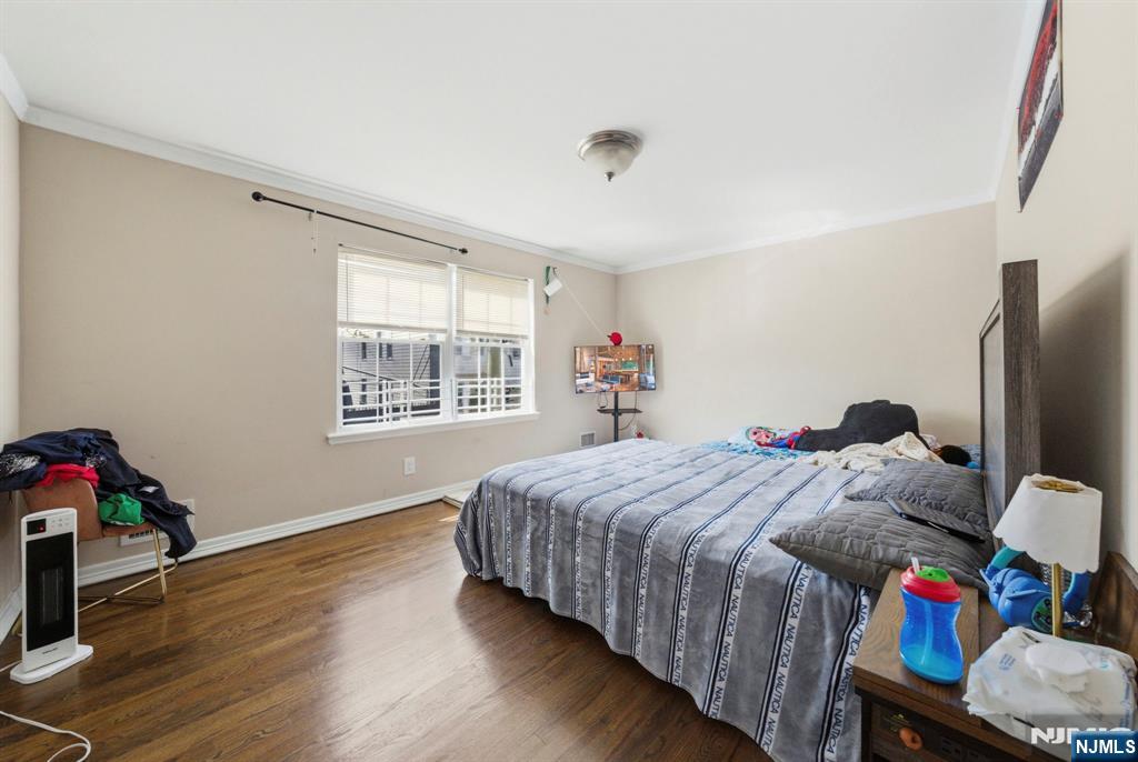 56 Lentz Avenue Newark, NJ 07105 - Photo 24 of 50 a bedroom with a bed and a window