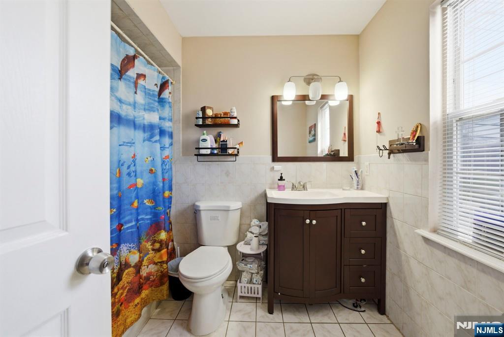 56 Lentz Avenue Newark, NJ 07105 - Photo 25 of 50 a bathroom with a sink toilet and shower