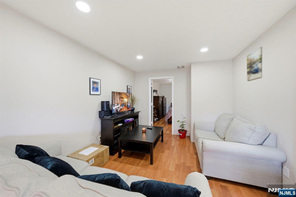 56 Lentz Avenue Newark, NJ 07105 - Photo 34 of 50 a living room with furniture and a couch