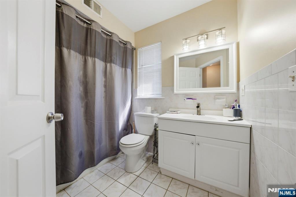 56 Lentz Avenue Newark, NJ 07105 - Photo 35 of 50 a bathroom with a sink toilet and shower