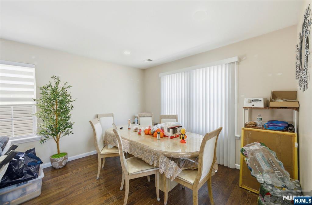 56 Lentz Avenue Newark, NJ 07105 - Photo 38 of 50 a view of a dining room with furniture window and wooden floor