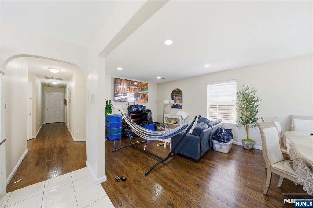 56 Lentz Avenue Newark, NJ 07105 - Photo 43 of 50 a living room with furniture a wooden floor and a large window