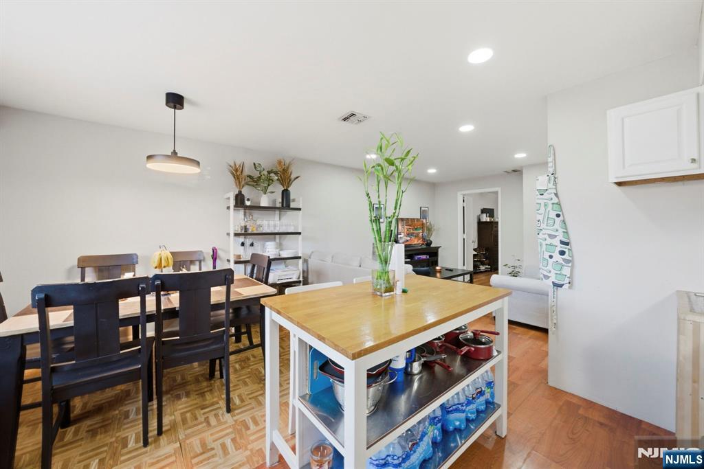 56 Lentz Avenue Newark, NJ 07105 - Photo 44 of 50 a view of a dining room with furniture and wooden floor