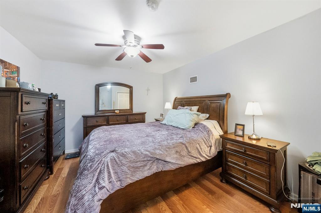 56 Lentz Avenue Newark, NJ 07105 - Photo 46 of 50 a bedroom with a bed and a chandelier