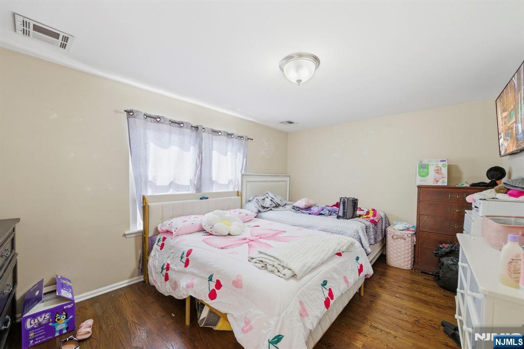 56 Lentz Avenue Newark, NJ 07105 - Photo 48 of 50 a bedroom with a bed and a window