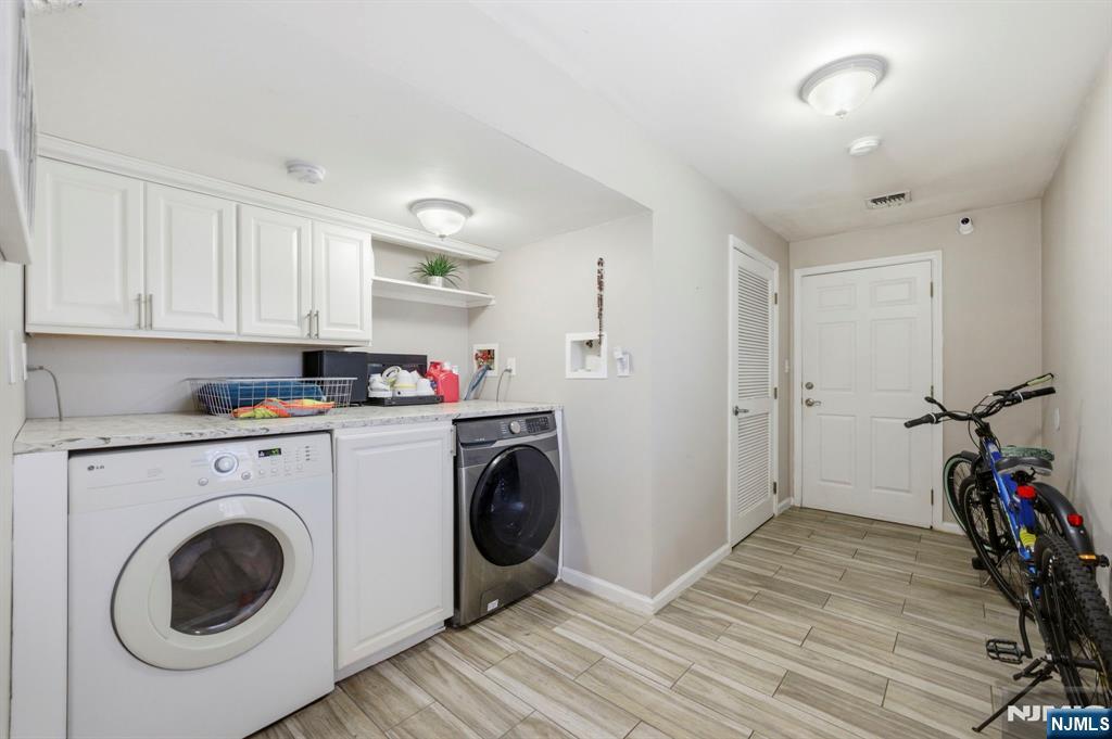 56 Lentz Avenue Newark, NJ 07105 - Photo 49 of 50 a view of kitchen sink and washer dryer
