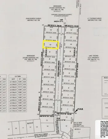 a outdoor space with lots of chairs and a table