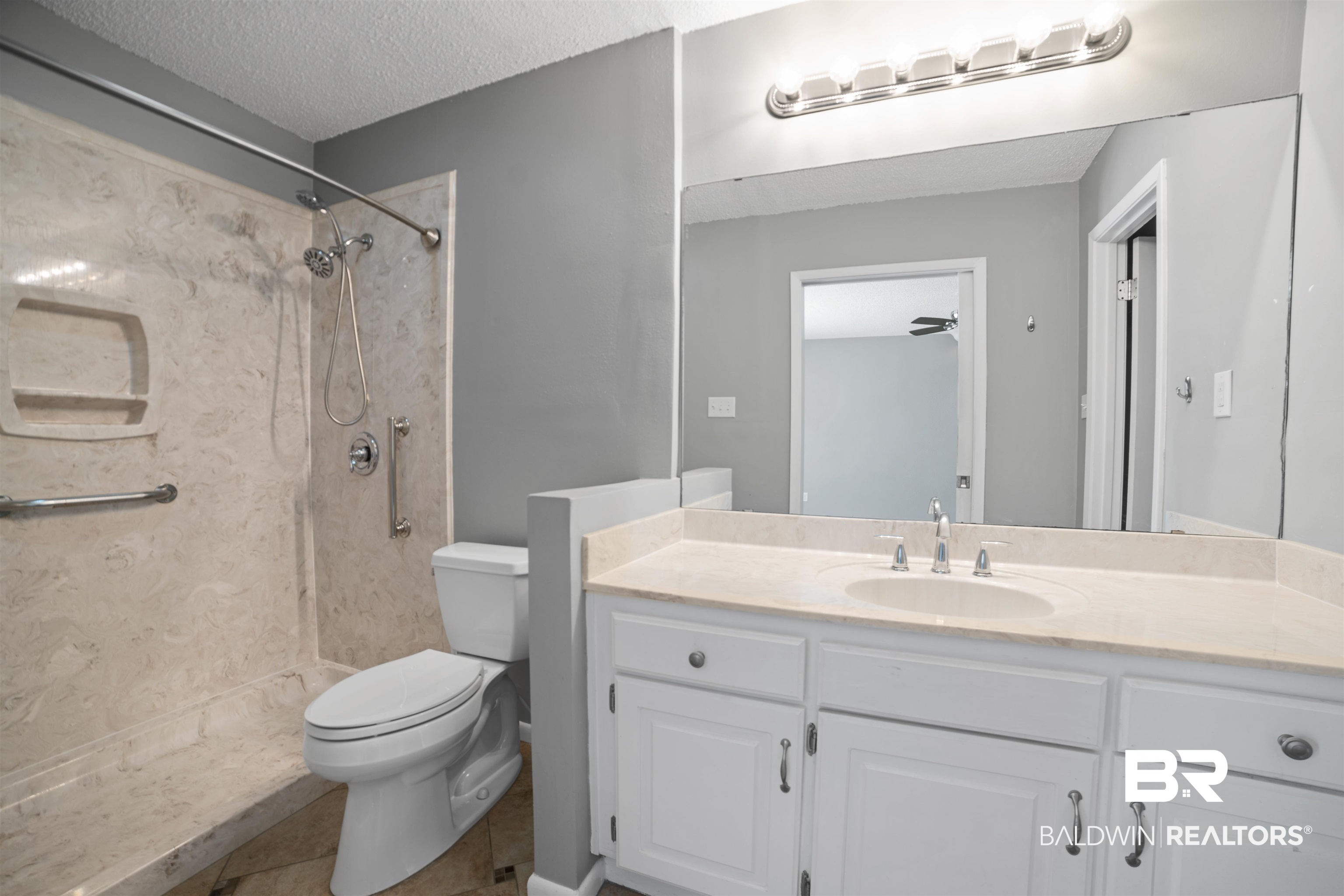 804 Regents Drive West Mobile, AL 36609 - Photo 20 of 35 Full bath with a textured ceiling, vanity, a shower, and tile patterned floors