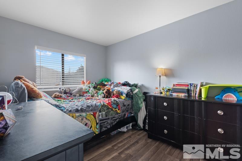 3885 Puffin Street Reno, NV 89508 - Photo 12 of 18 a bedroom with a bed and a dresser