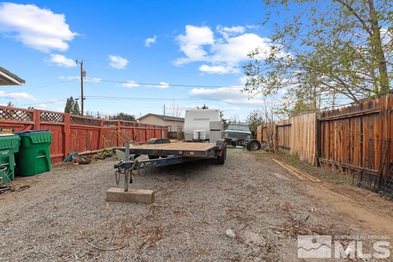 3885 Puffin Street Reno, NV 89508 - Photo 15 of 18 a backyard of a house with barbeque oven table and chairs