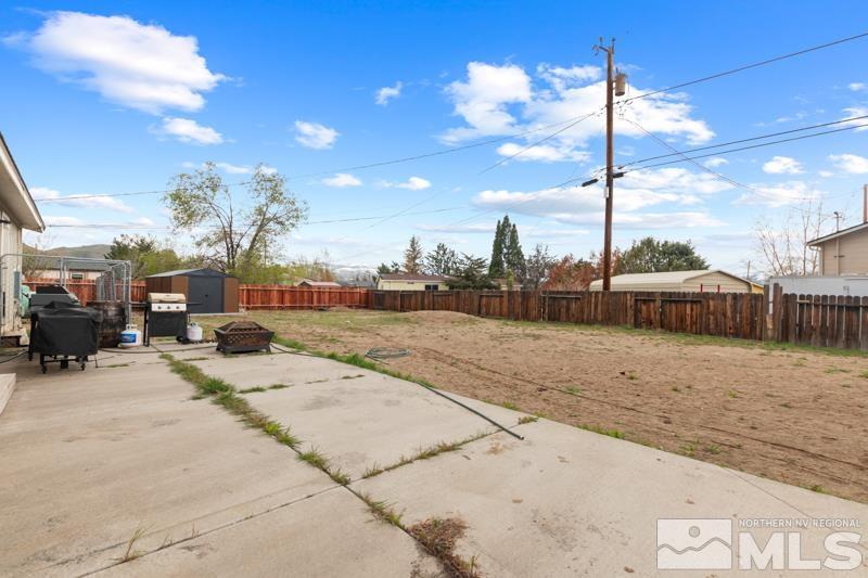 3885 Puffin Street Reno, NV 89508 - Photo 16 of 18 a view of a street with a building in the background