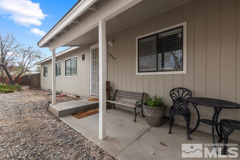 3885 Puffin Street Reno, NV 89508 - Photo 4 of 18 a backyard of a house with table and chairs