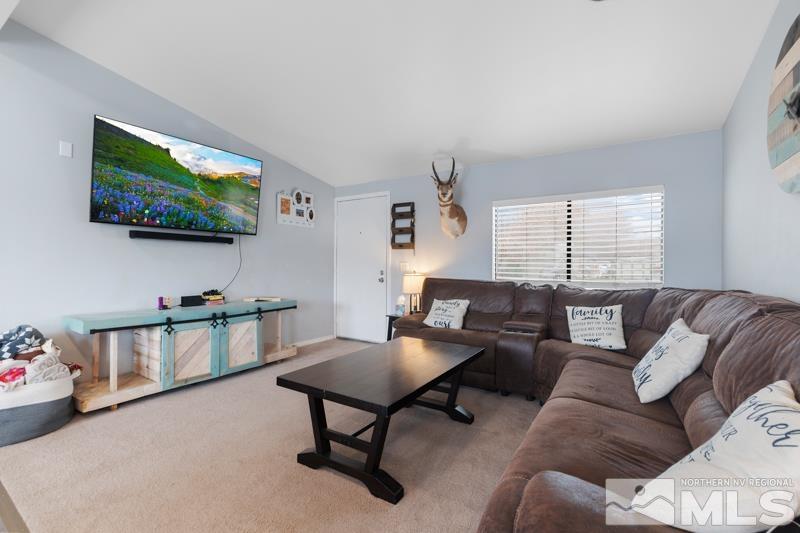 3885 Puffin Street Reno, NV 89508 - Photo 5 of 18 a living room with furniture and a flat screen tv