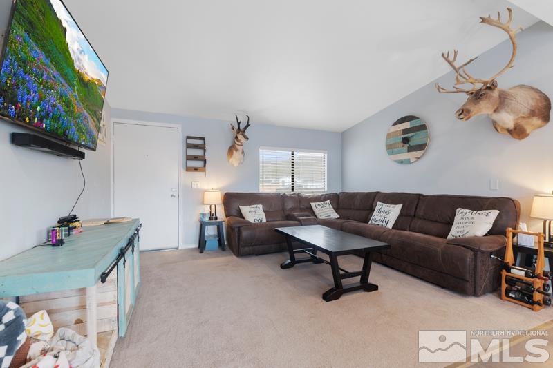 3885 Puffin Street Reno, NV 89508 - Photo 6 of 18 a living room with furniture and a flat screen tv