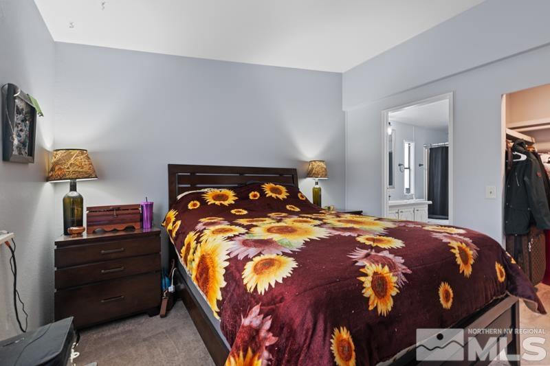 3885 Puffin Street Reno, NV 89508 - Photo 10 of 18 a bedroom with a bed and wooden floor