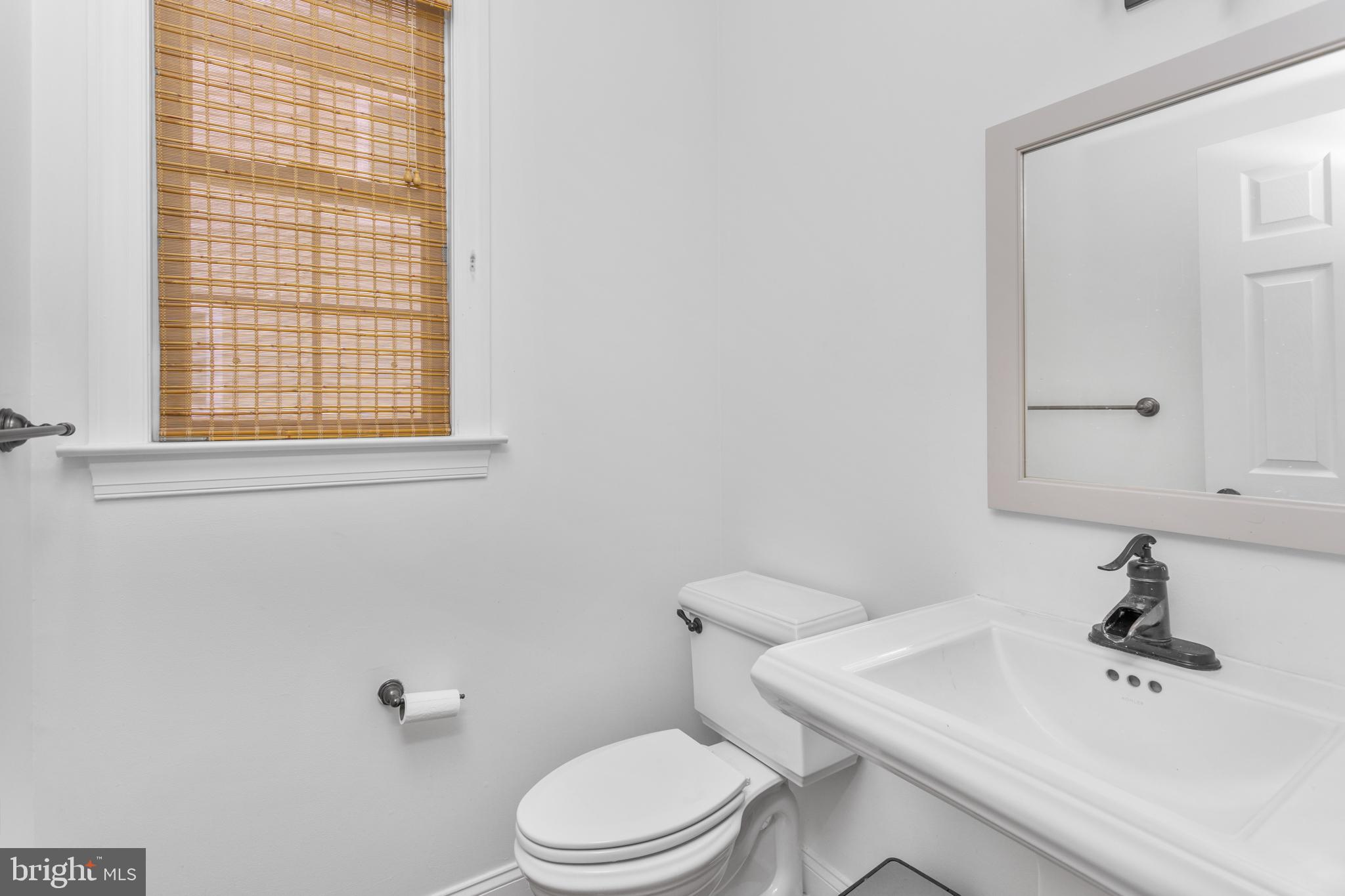 6 Hulse Street Robbinsville, NJ 08691 - Photo 14 of 75 a bathroom with a sink a toilet and a mirror