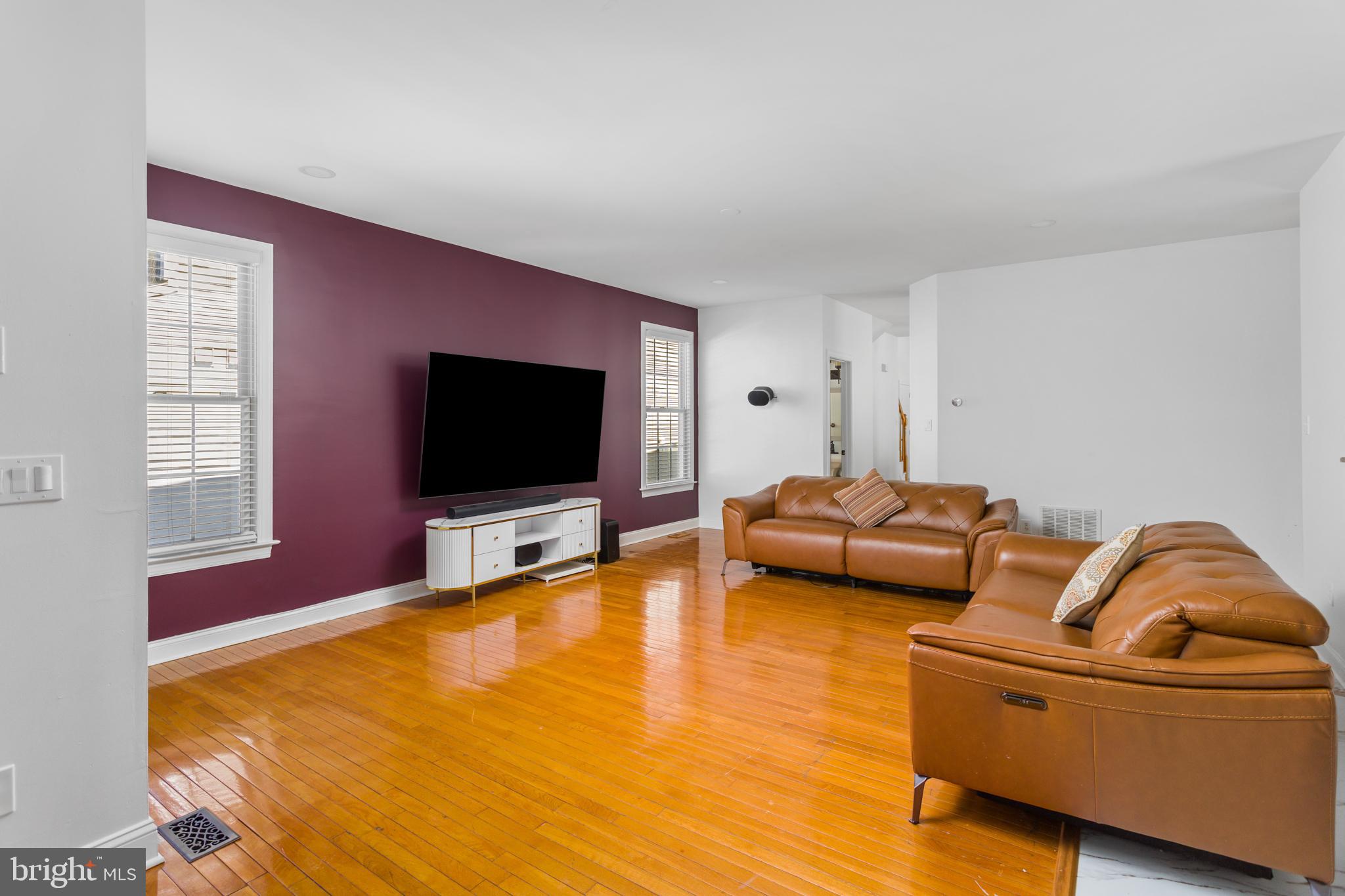 6 Hulse Street Robbinsville, NJ 08691 - Photo 16 of 75 a living room with furniture and a flat screen tv