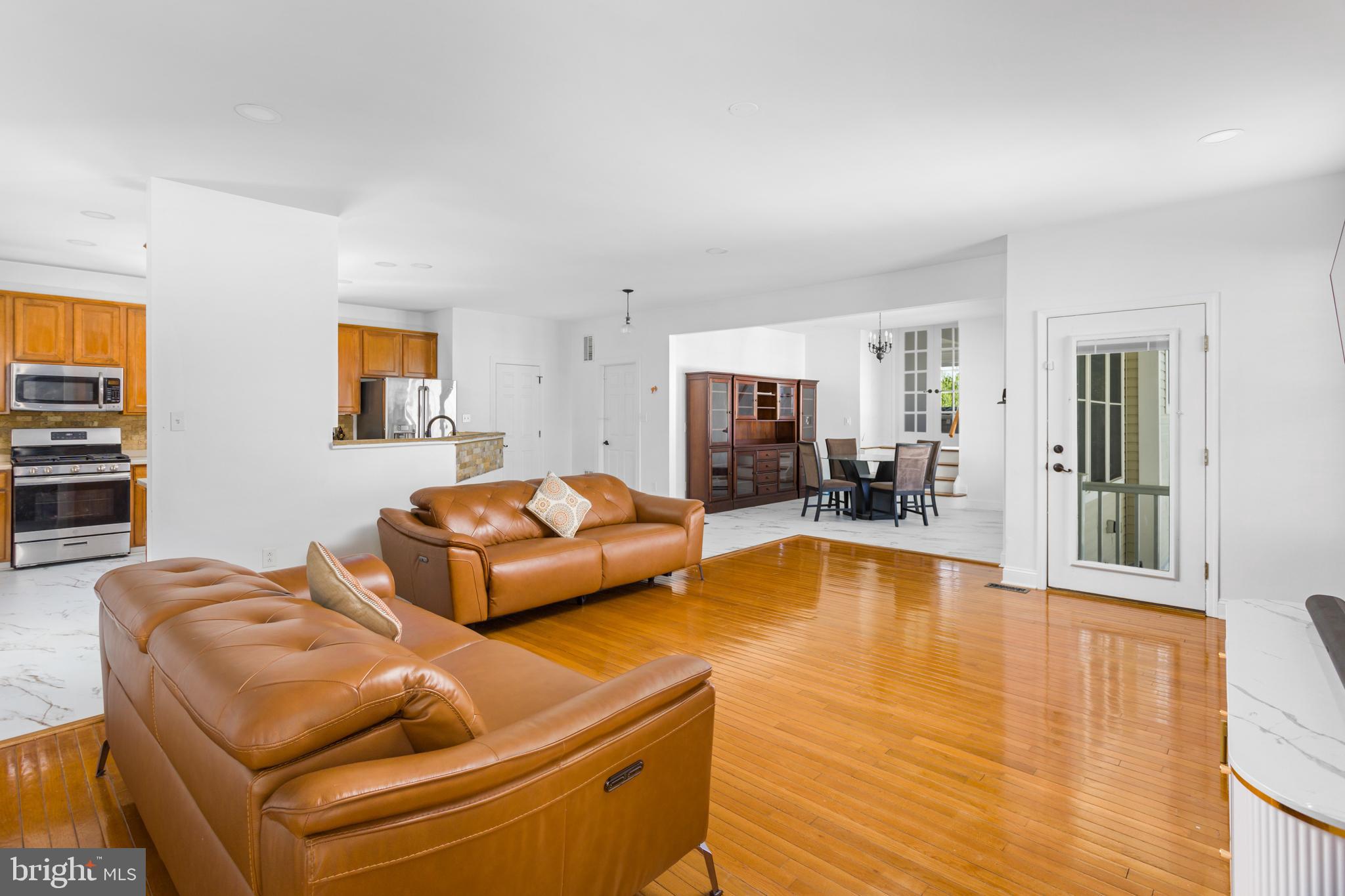 6 Hulse Street Robbinsville, NJ 08691 - Photo 18 of 75 a living room with furniture and a table with wooden floor