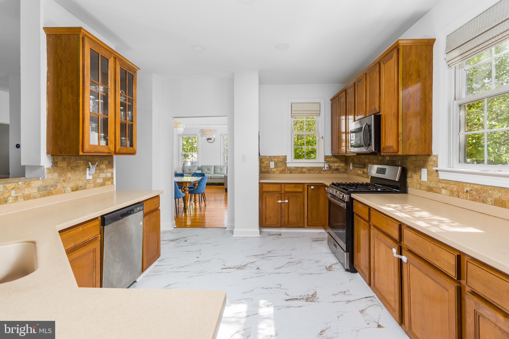 6 Hulse Street Robbinsville, NJ 08691 - Photo 20 of 75 a kitchen with stainless steel appliances granite countertop a sink counter space cabinets and a large window