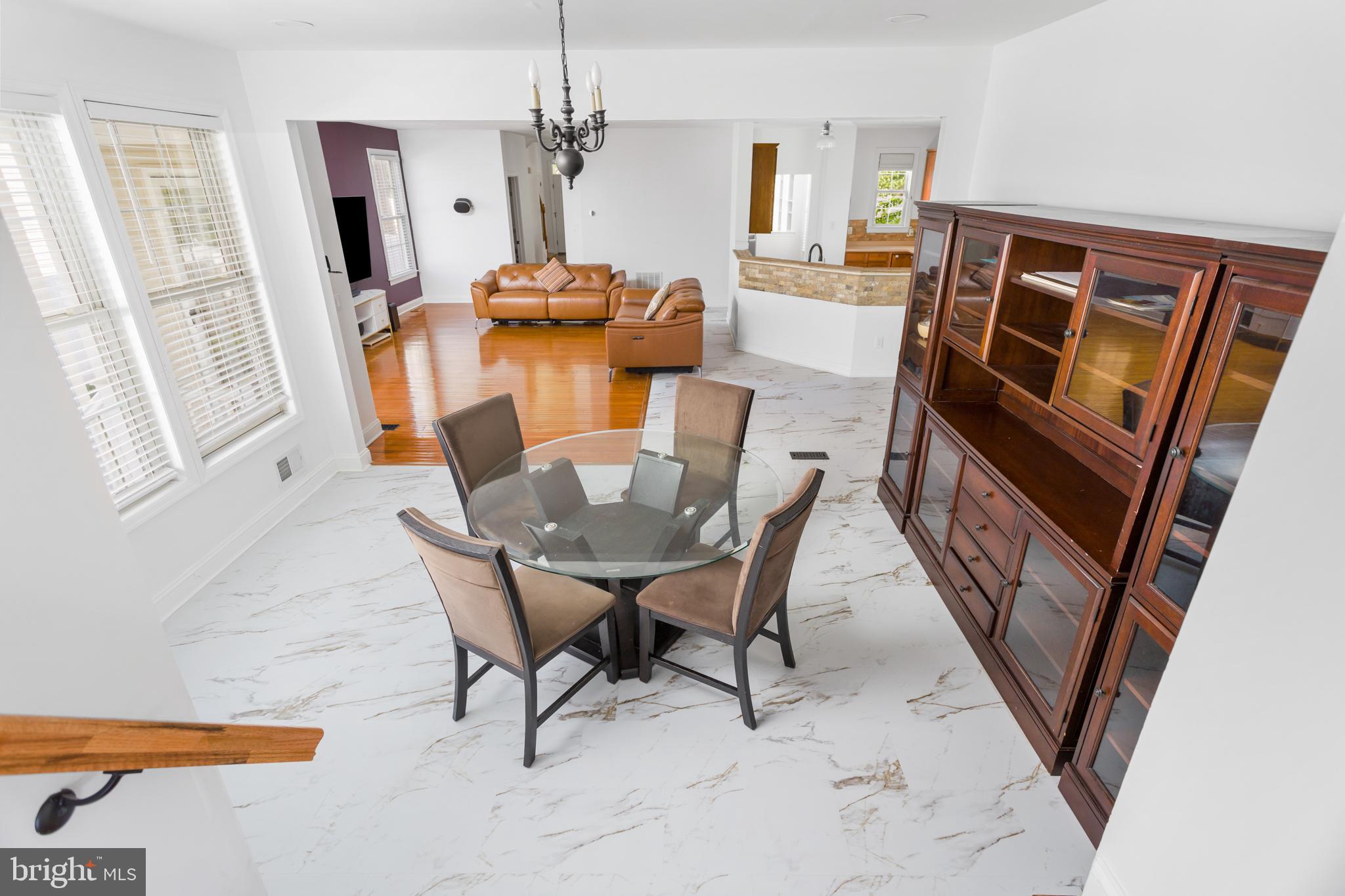 6 Hulse Street Robbinsville, NJ 08691 - Photo 25 of 75 a view of a dining room with furniture and a chandelier