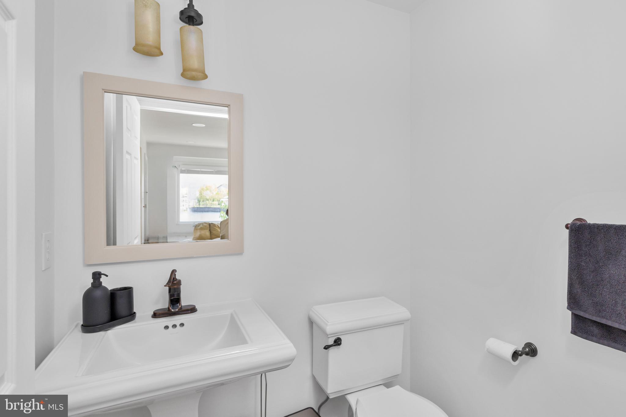 6 Hulse Street Robbinsville, NJ 08691 - Photo 30 of 75 a bathroom with a sink a toilet and mirror