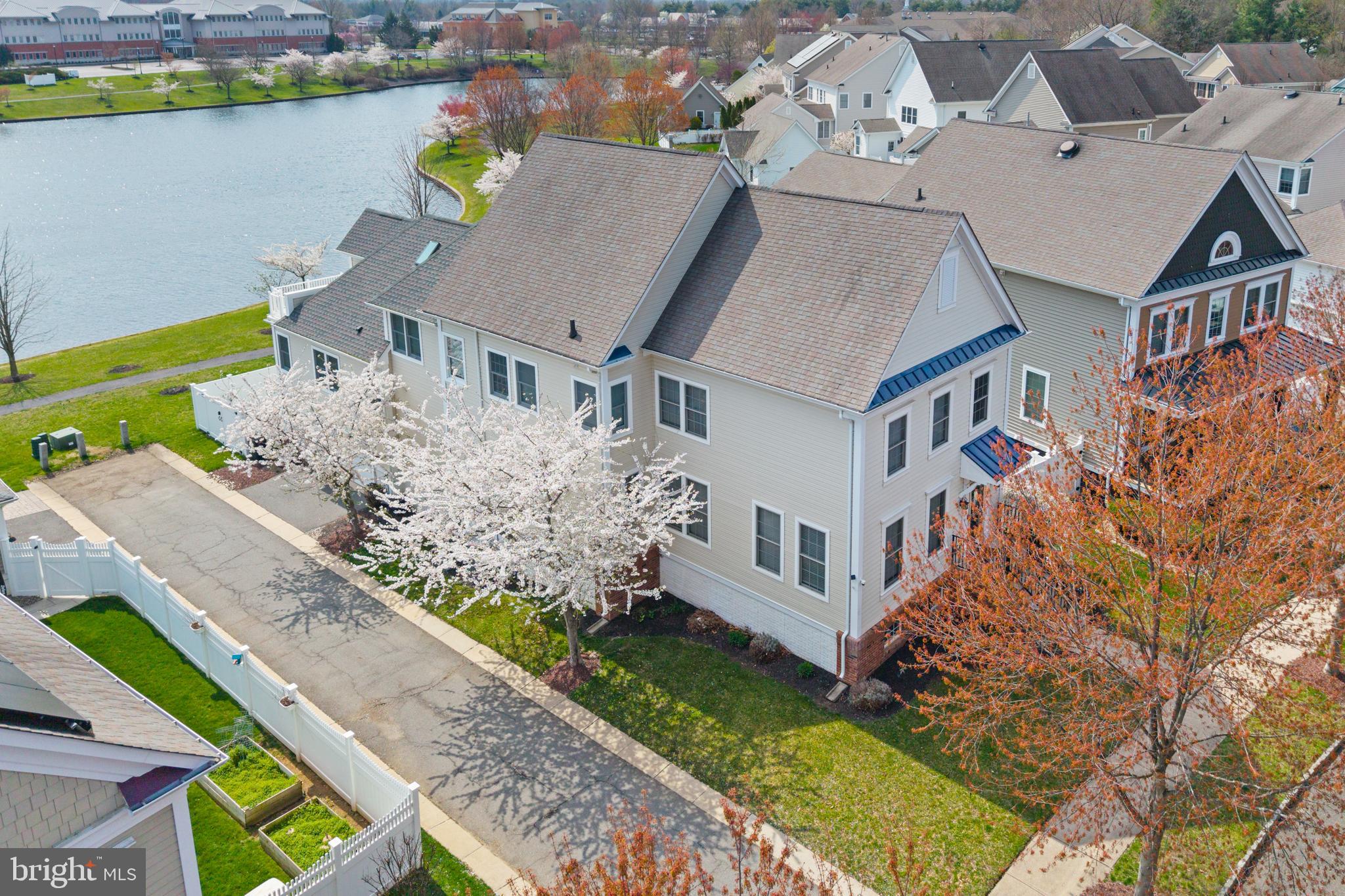 6 Hulse Street Robbinsville, NJ 08691 - Photo 4 of 75 an aerial view of a house with a garden and lake view