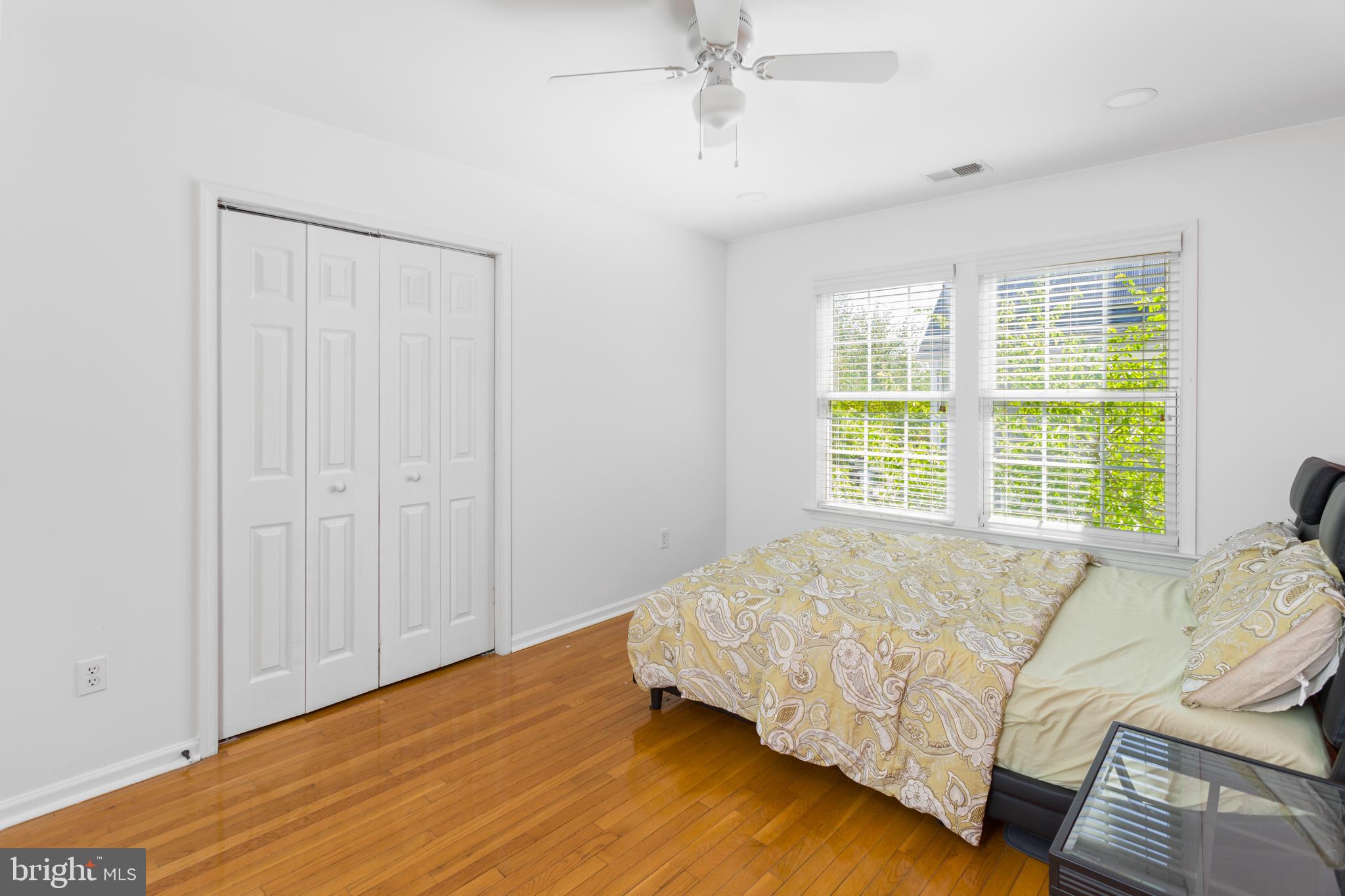6 Hulse Street Robbinsville, NJ 08691 - Photo 49 of 75 a bed sitting in a bedroom next to a window and a chandelier