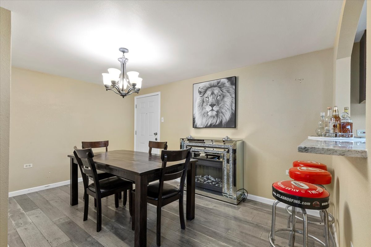 240 Riddle Road Cedar Creek, TX 78612 - Photo 12 of 31 a view of a dining room with furniture and wooden floor