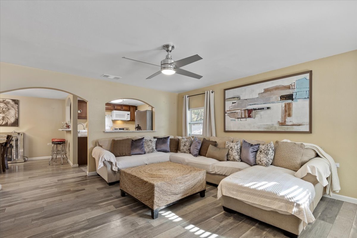 240 Riddle Road Cedar Creek, TX 78612 - Photo 14 of 31 a living room with furniture and a ceiling fan