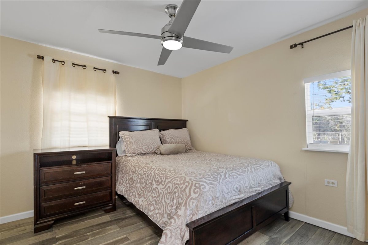 240 Riddle Road Cedar Creek, TX 78612 - Photo 18 of 31 a bedroom with a bed and a dresser