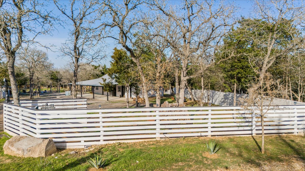 240 Riddle Road Cedar Creek, TX 78612 - Photo 25 of 31 a view of a house with a yard